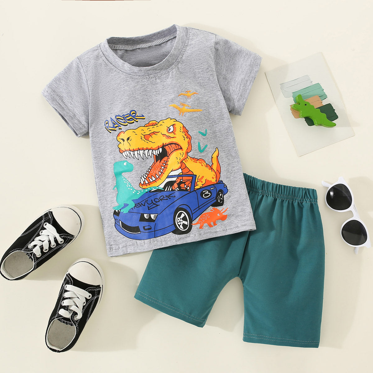 Mayoreo Camiseta con estampado de dinosaurio y vehículo de algodón puro para niños pequeños de 2 piezas y pantalones de color sólido gris 12-18 M